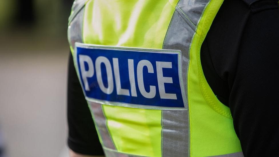 Generic image showing a police officer wearing a hi-vis vest.