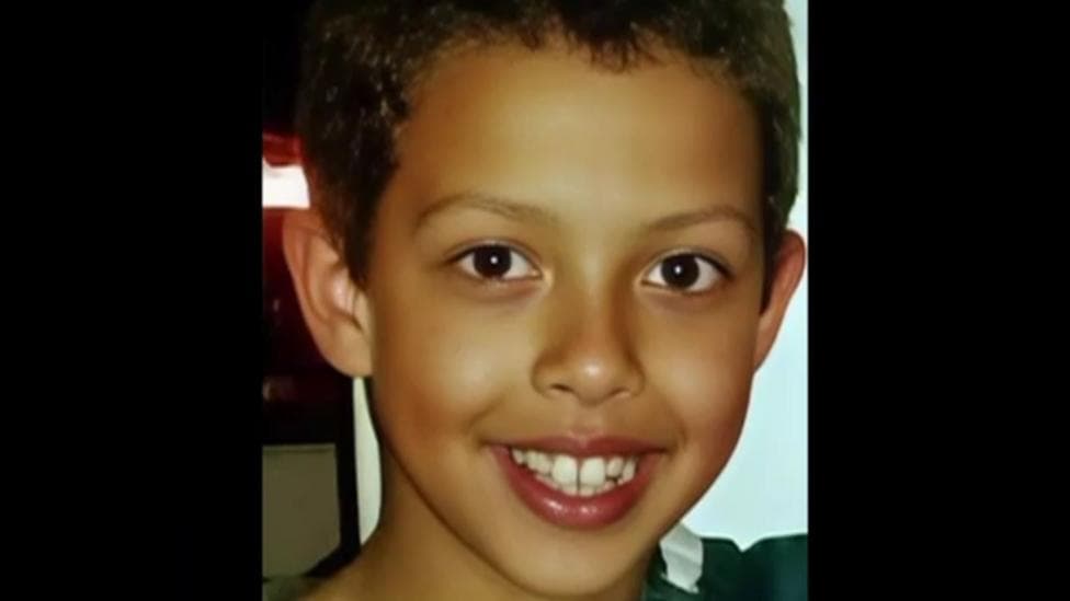 A young Noah Donohoe is smiling directly at the camera.