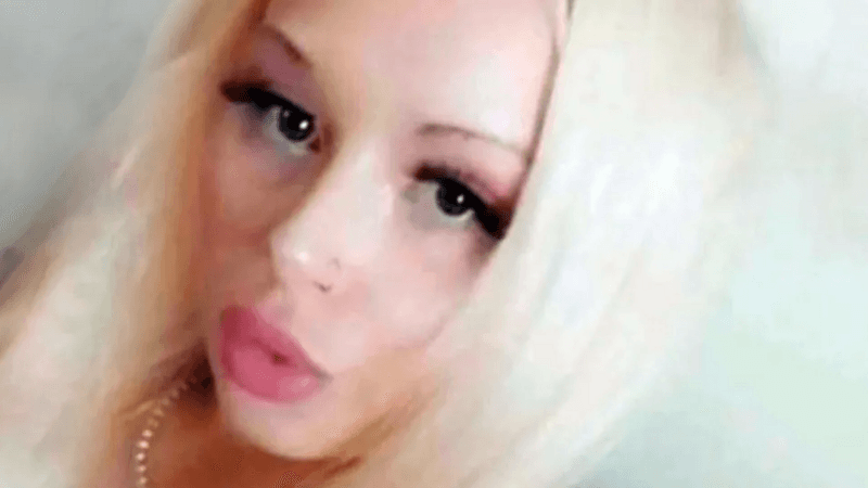 Brodie MacGregor, a young woman with blonde hair, black eyeliner and purple eye shadow, taking a selfie