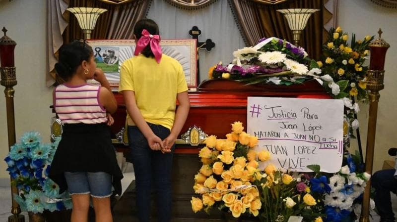 Relatives and friends attend the wake of murdered environmentalist Juan Lopez in Tocoa, Honduras, on 15 September, 2024. (Photo by Orlando SIERRA / AFP) (Photo by ORLANDO SIERRA/AFP via Getty Images)