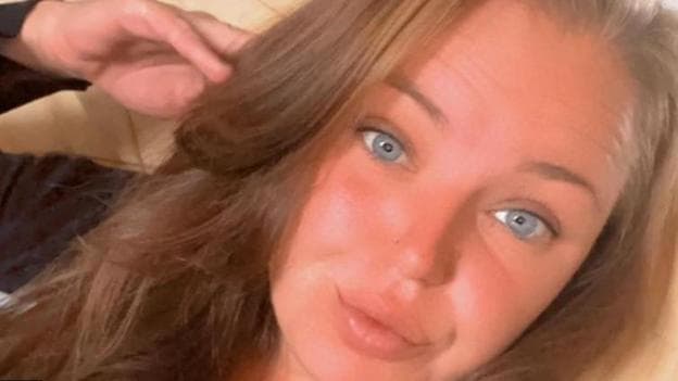 A close-up of Saffron Cole-Nottage. She has brown hair and blue eyes. It is a selfie-style shot.