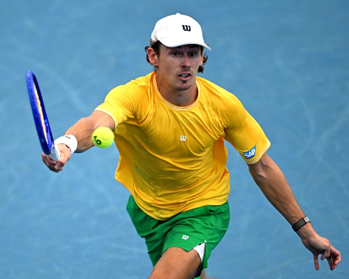 Alex de Minaur defeats Maks Kaśnikowski to give Australia an early lead over Poland in the Davis Cup World Group I tie at Pat Rafter Arena in Brisbane