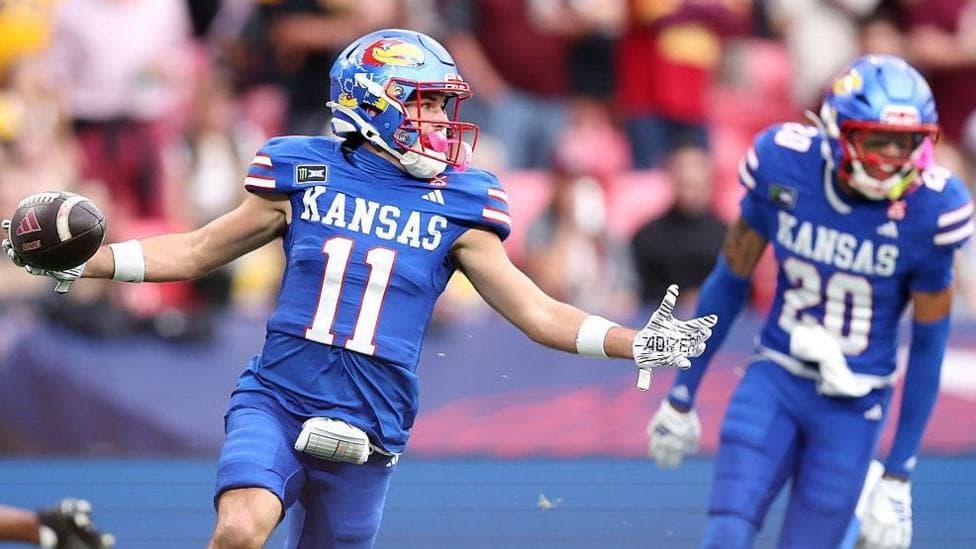 Tate Nagy celebrates scoring a touchdown for the Kansas Jayhawks against the Arizona State Sun Devils at Wembley