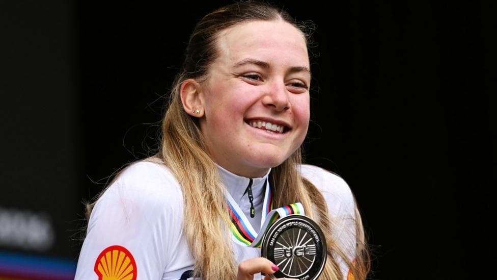 Zoe Backstedt smiles holding her World Championship silver medal.