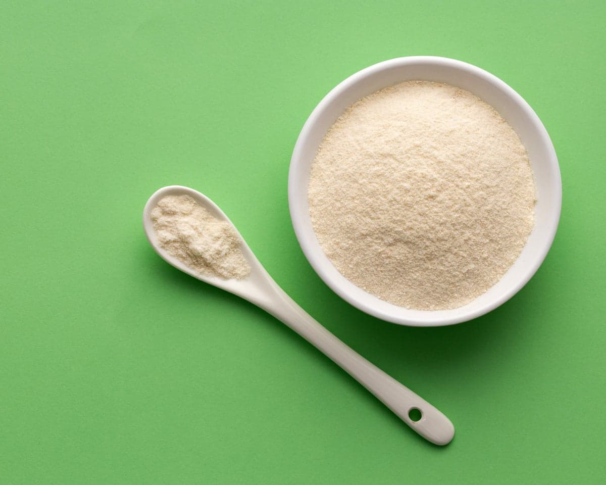 Organic gelatin powder, also called hydrolysed collagen, in a bowl and spoon