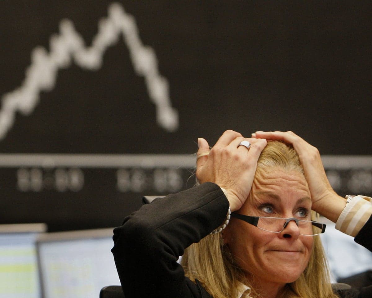 A broker at the stock exchange in Frankfurt, central Germany, on 16 September 2008.