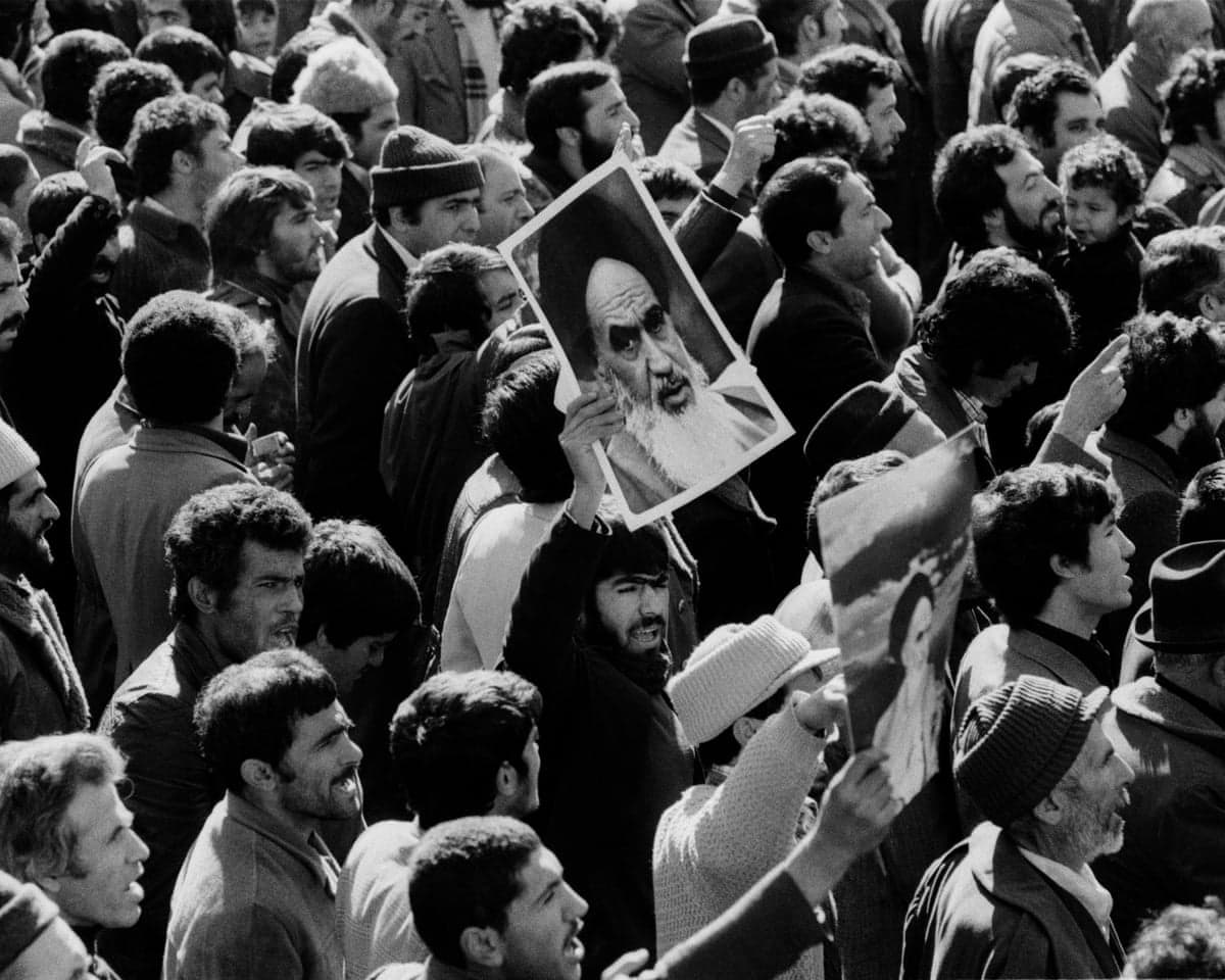 Posters of Ayatollah Khomeini during the 1979 Iranian revolution .