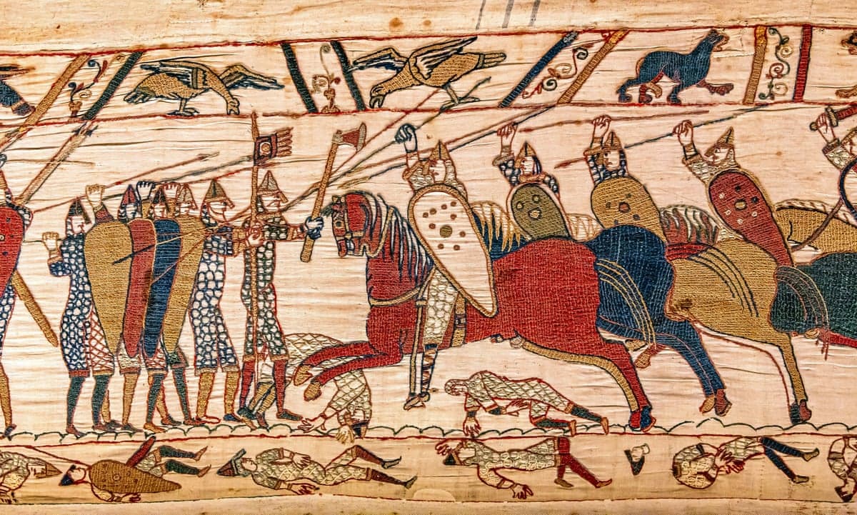 Bayeux Tapestry scene of mounted knights battling foot soldiers, with fallen bodies below
