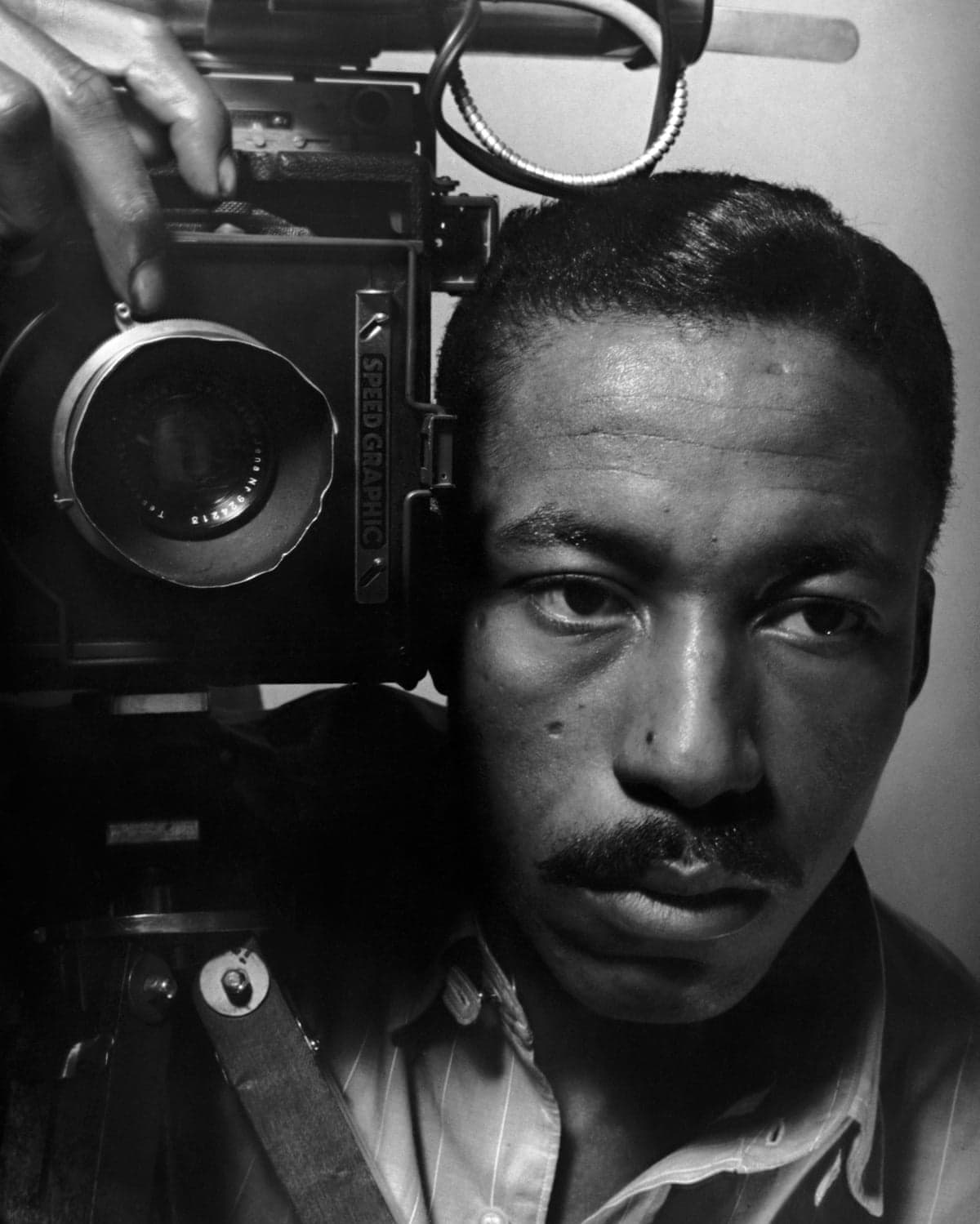A black-and-white self-portrait of Gordon Parks.
