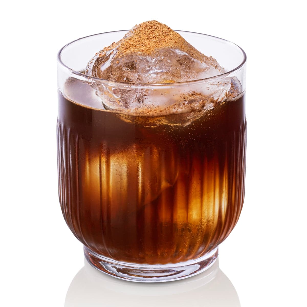 A glass of Buster's stout punch with crushed ice and a dusting of brown spice on top