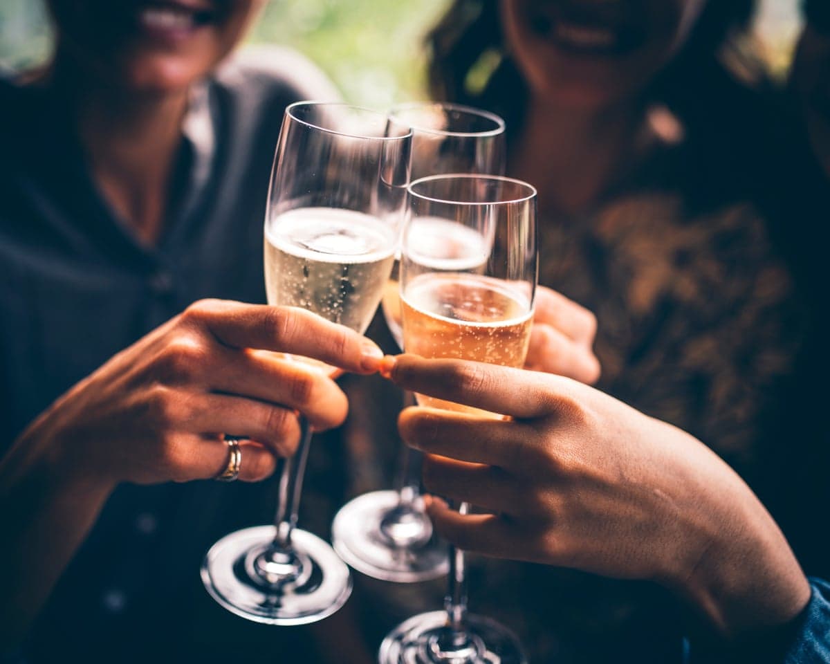 A group of people clinking glasses of champagne