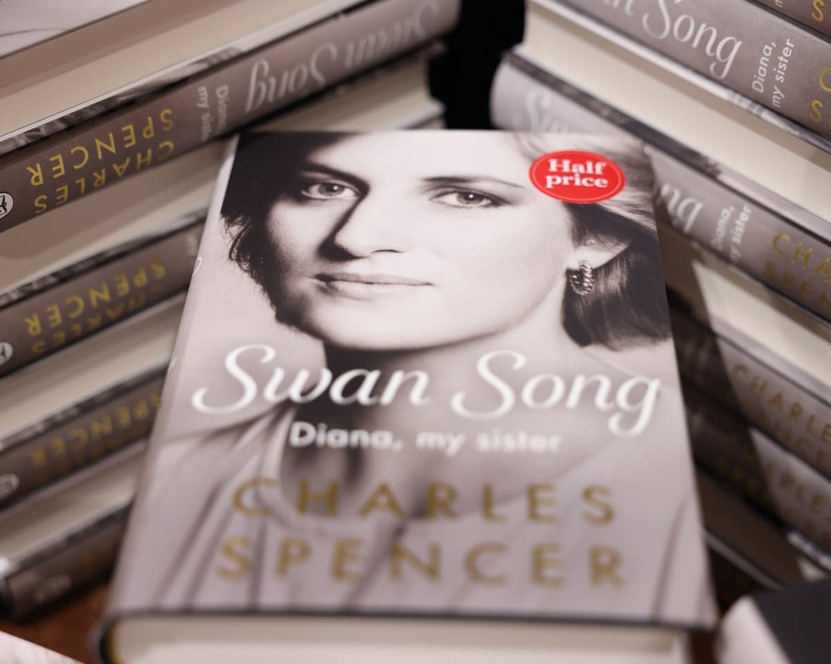 Stacked copies of Swan Song, Charles Spencer's memoir about his sister Princess Diana