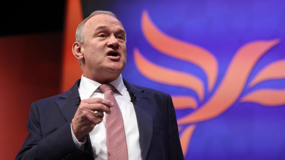 Ed Davey delivers speech to Lib Dem conference in suit and tie