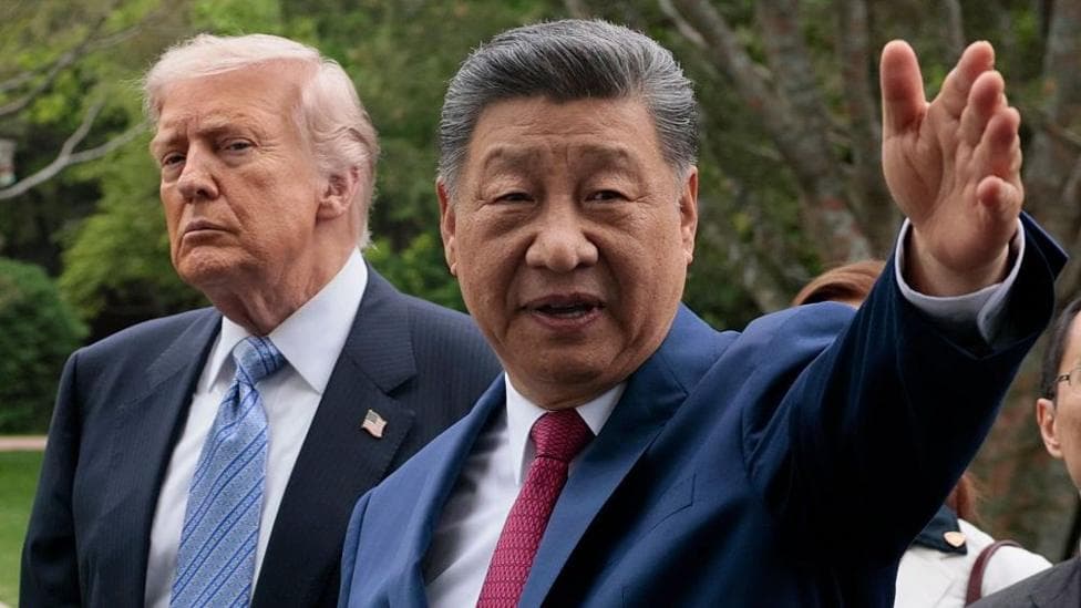 US President Donald Trump listens on as Chinese leader Xi Jinping takes him on a tour of China's Zhongnanhai Garden in Beijing on 15 May, 2026.