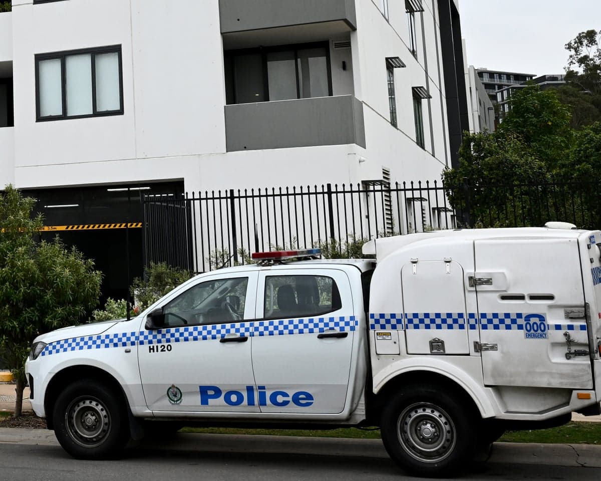 A police car outside the building in Norwest, Sydney where the 11-year old-boy suffered his fatal injuries.