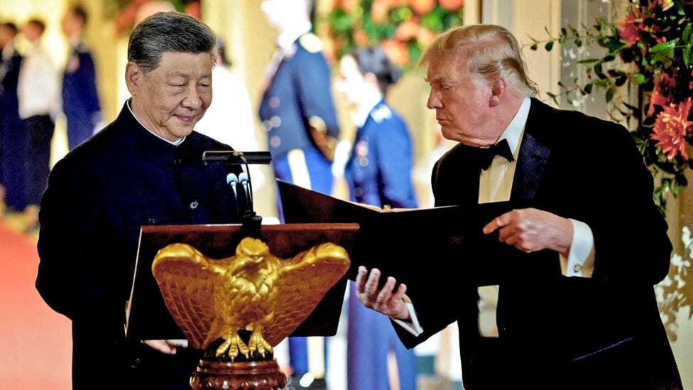 US President Donald Trump holds a binder as he stands next to Chinese President Xi Jinping before Xi delivers a speech during a state dinner at the White House in Washington, D.C., US, September 24, 2026.