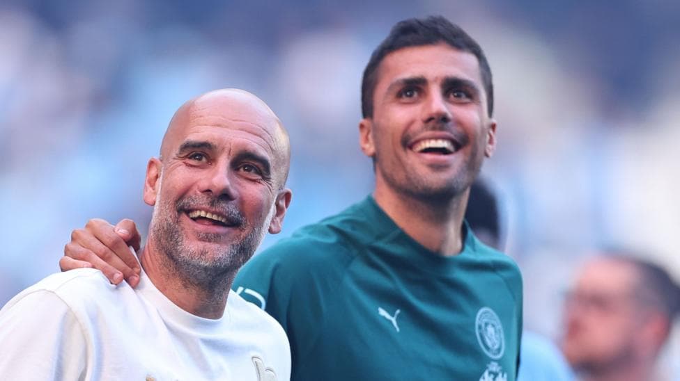 Ex-Manchester City midfielder Rodri and manager Pep Guadiola