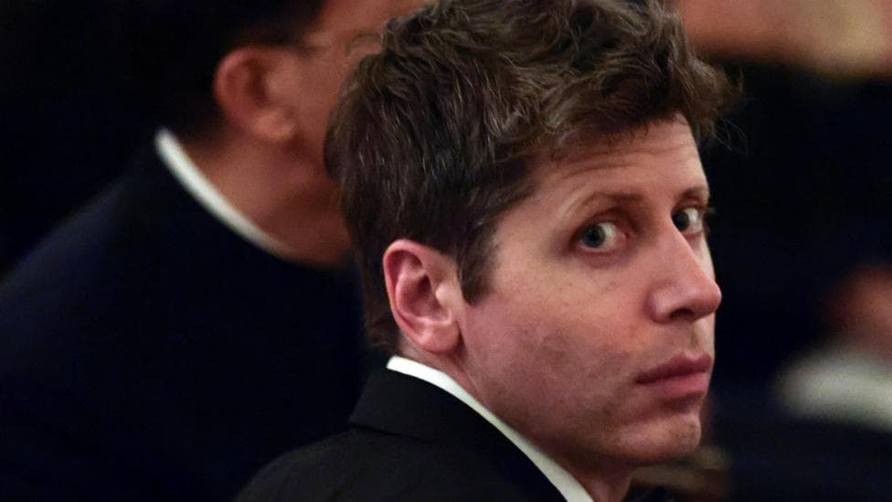 OpenAI CEO Sam Altman sitting at a dinner at the White House.
