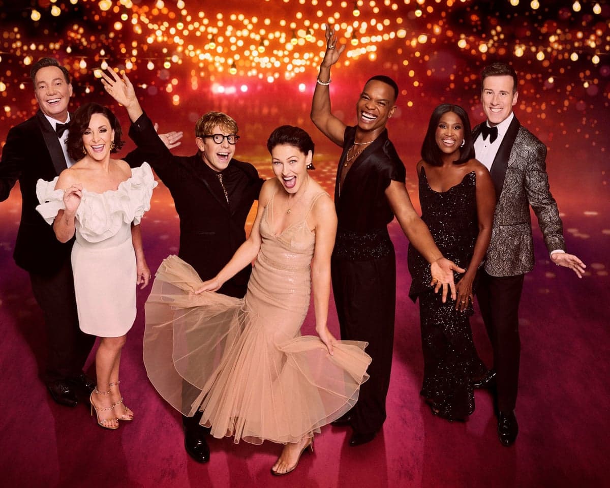 Strictly Come Dancing judges and hosts Emma Willis, Johannes Radebe and Josh Widdicombe cheer together