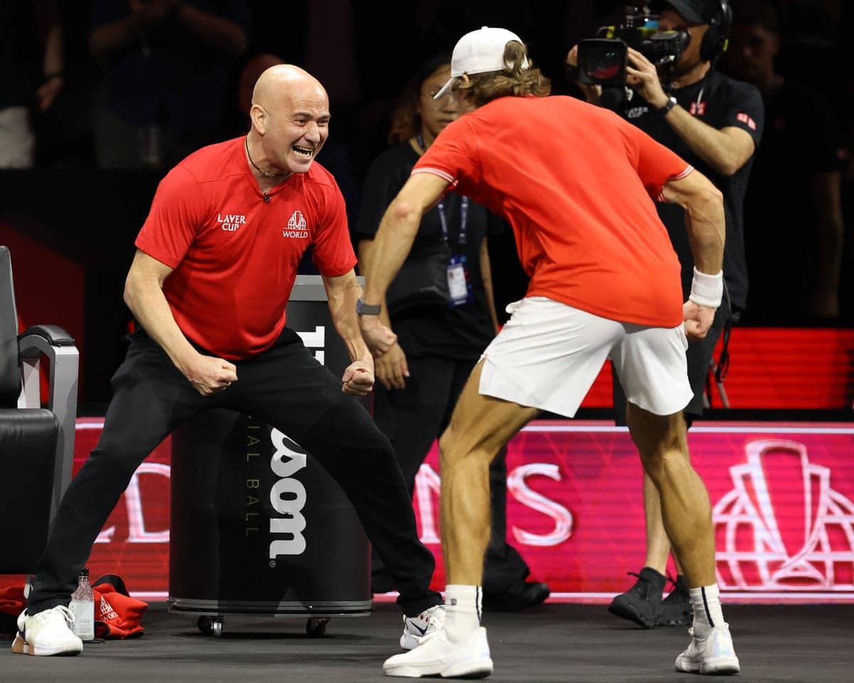 Alex de Minaur (right) celebrates with his Team World captain Andre Agassi after beating Team Europe's Alexander Zverev on day two of the Laver Cup in London.