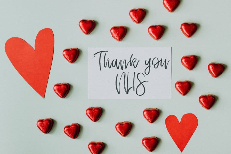 A thank you card with red heart chocolates and text for NHS appreciation.