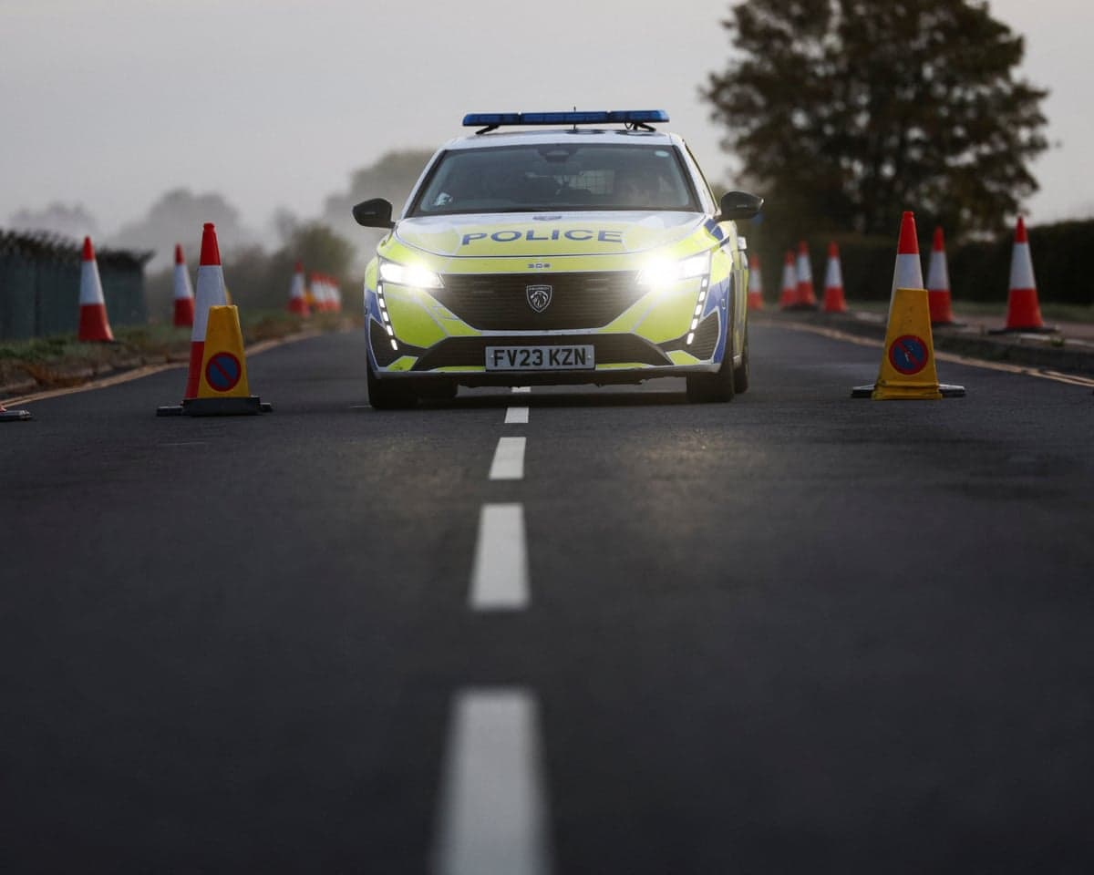 A police vehicle on a road outside the perimeter of the RAF Fairford airbase on Monday as investigations continued