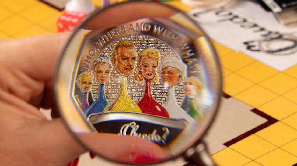 New Royal Mint 50p coin close-up showing five different coloured game tokens with illustrations on top representing the characters in the board game