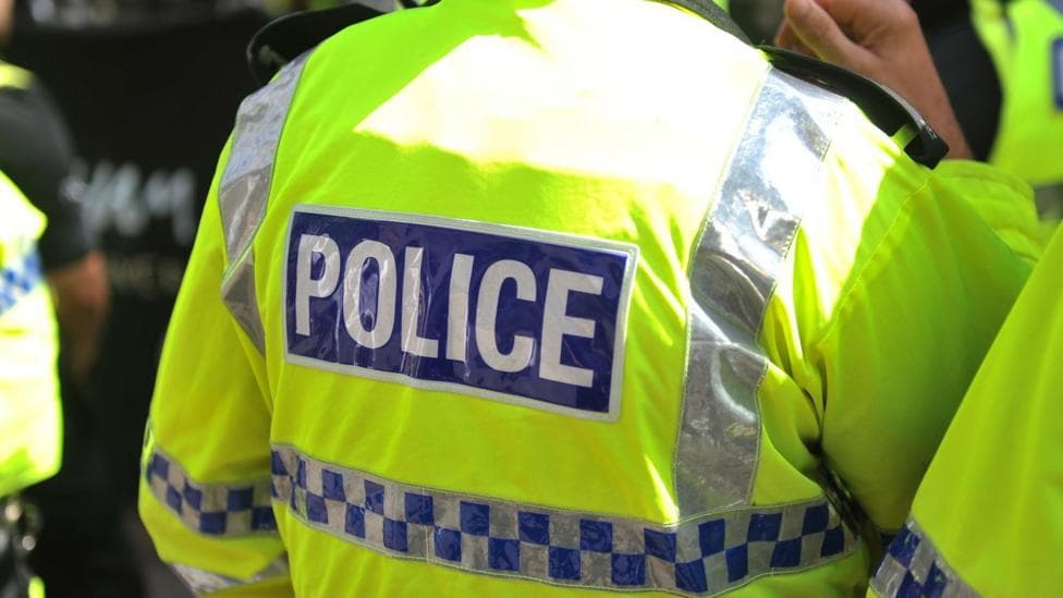 Generic police image of back of officer