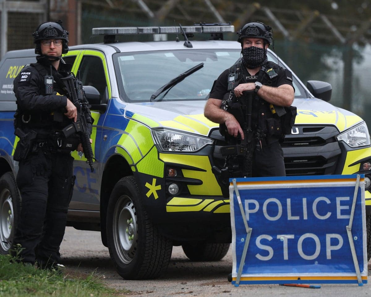 Police officers guard an area as roadblocks remain in place near RAF Fairford airbase on 29 September, 2026.
