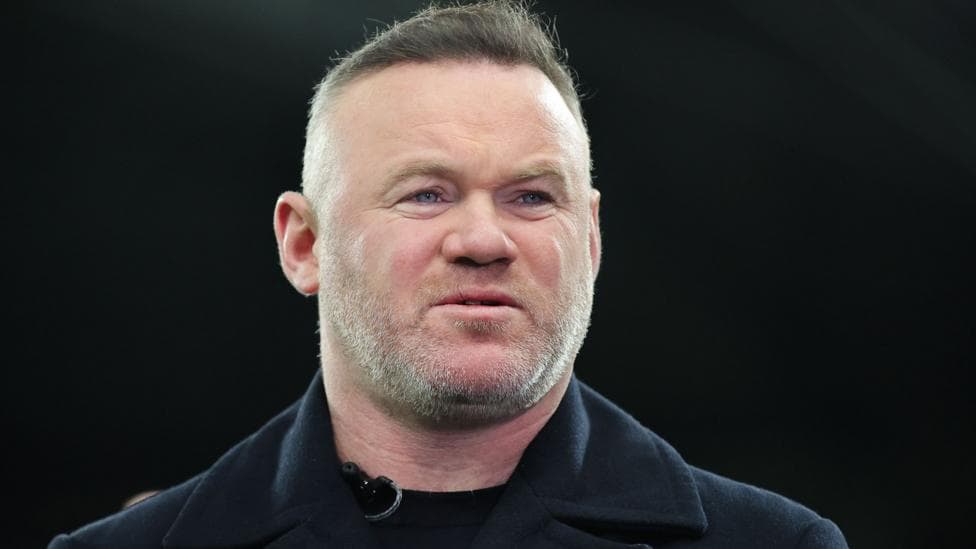 Former Manchester United striker Wayne Rooney looks on