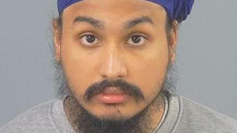 Custody photograph of Vickrum Digwa wearing a turban and grey sweatshirt.
