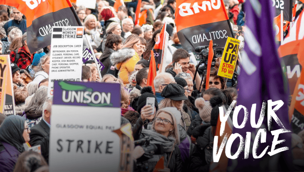 A crowd of people waving GMB and Unison flags and banners. One says Glasgow Equal Pay Strike