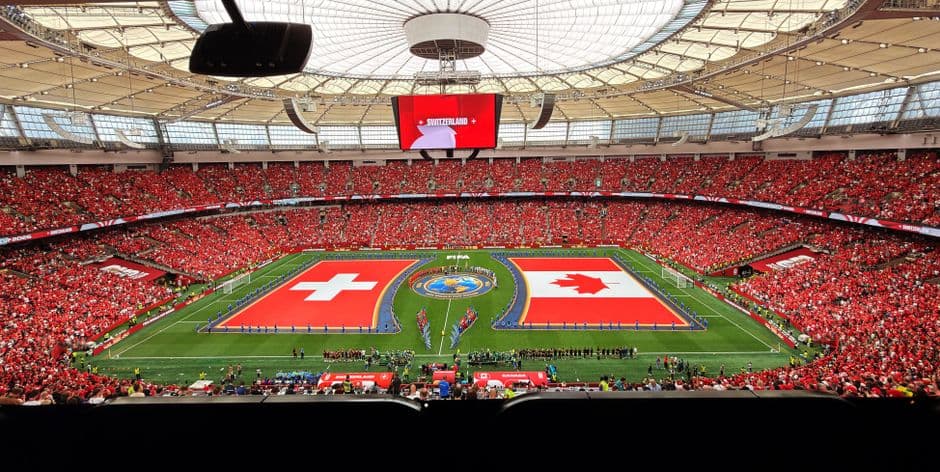 A vibrant soccer match between Switzerland and Canada in BC Place, Vancouver.