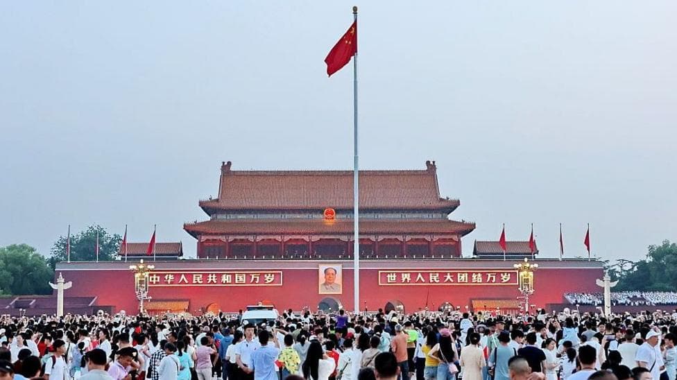 Crowds gather at Tiananmen Square to watch a flag-raising ceremony on July 1, 2026 in Beijing, China