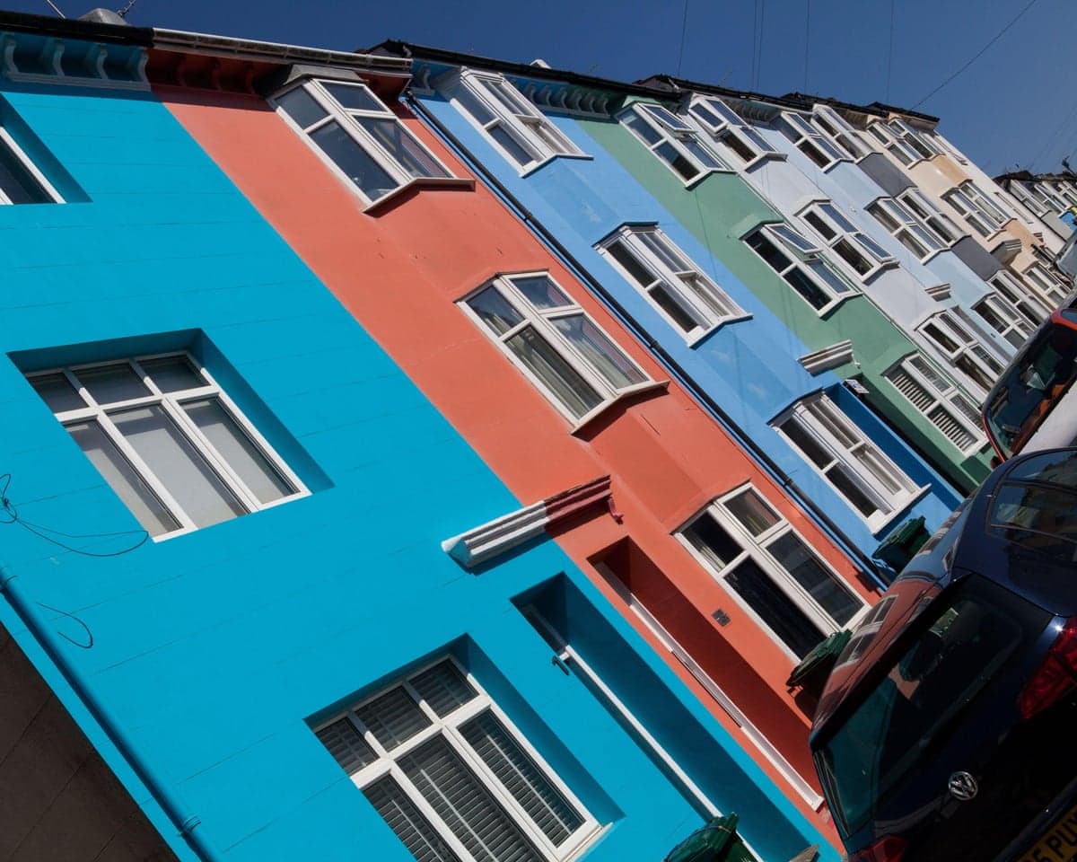 A terrace of brightly painted houses in Brighton