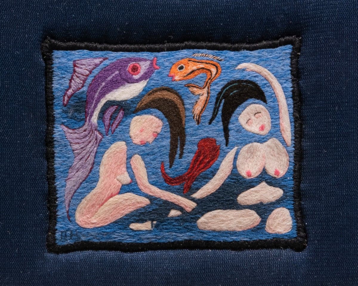 Embroidery of nude women and fishes