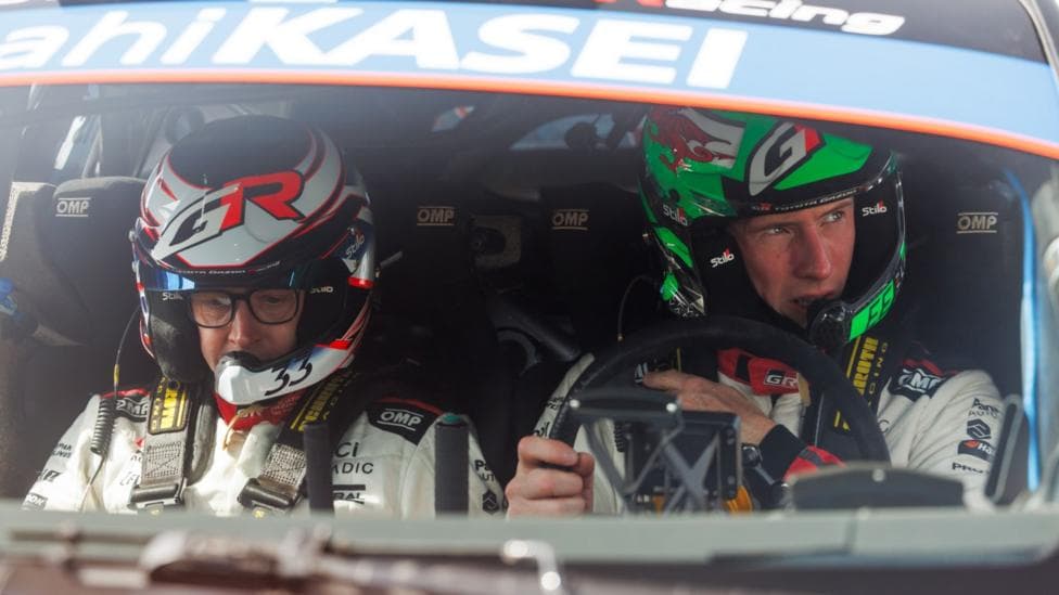 Elfyn Evans (right) and co-driver Scott Martin pictured through their car windshield.