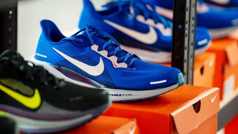 Nike trainers in a shop displayed on top of a Nike shoe box