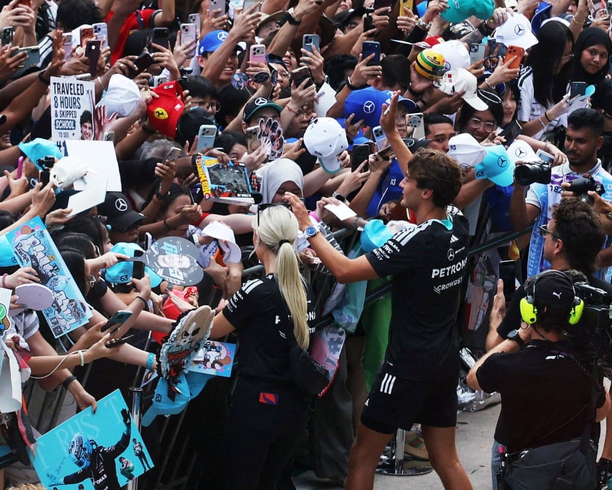 Mercedes' George Russell signs autographs for fans ahead of the Bahrain Grand Prix