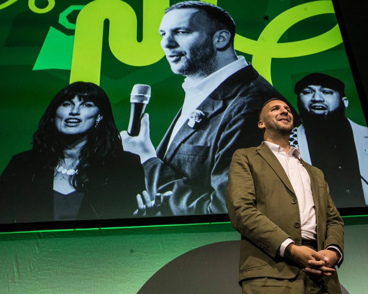 Zack Polanski standing on stage at the Green party conference