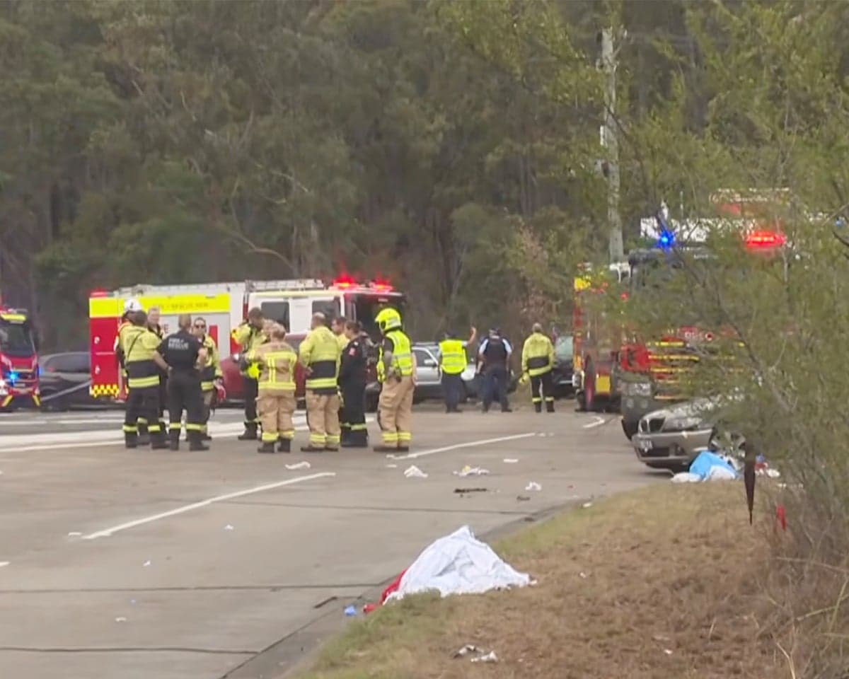 Emergency crews gather at a crash scene where NRL fans were struck by a car