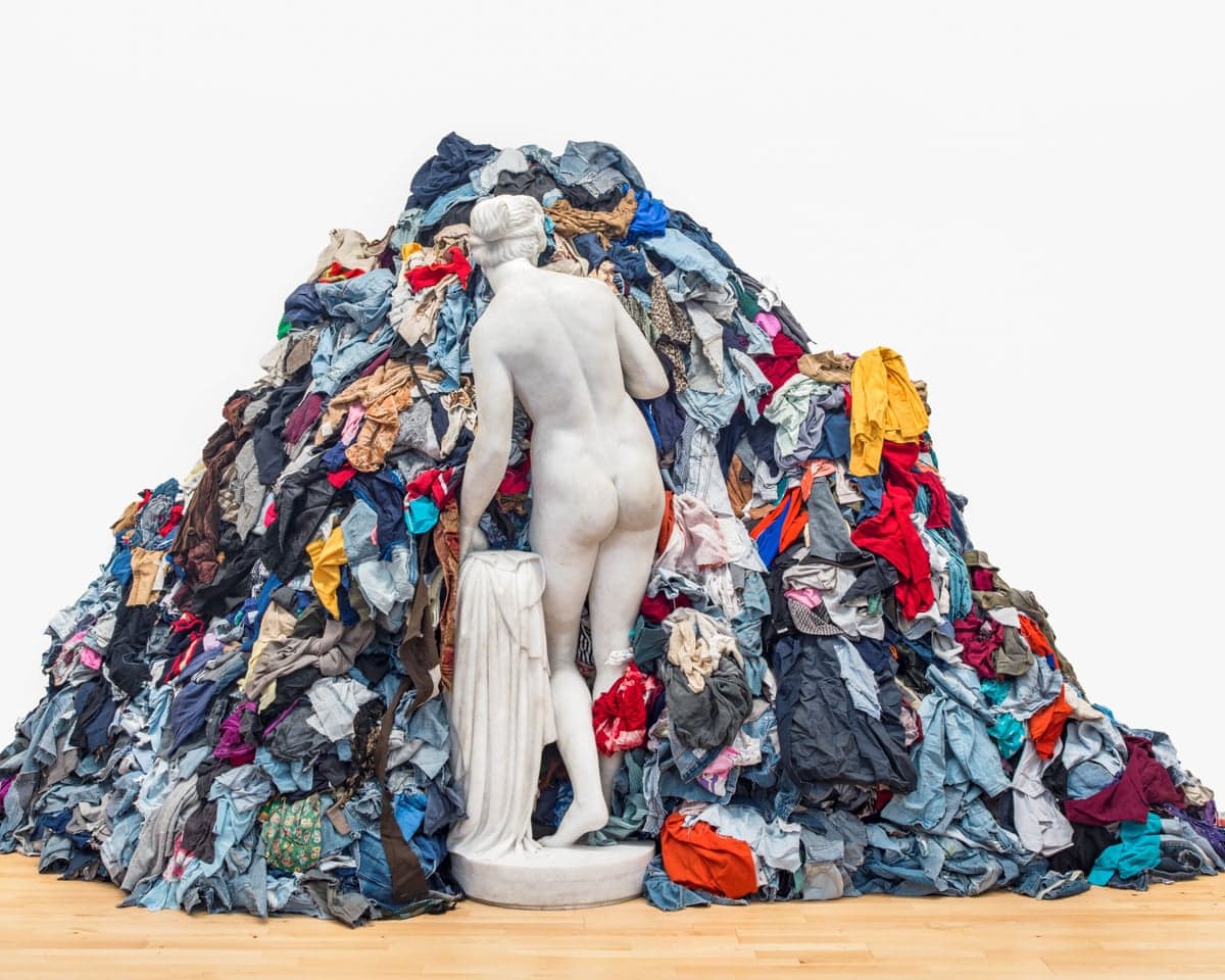 Pistoletto's marble Venus statue stands facing a huge mound of colourful rags