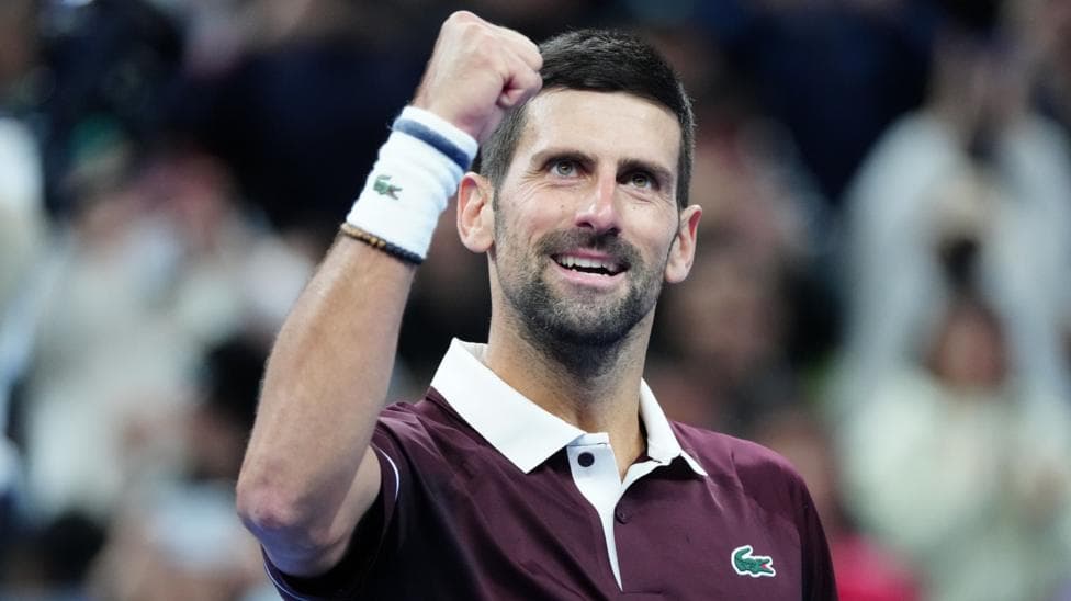 Novak Djokovic clenches his fist in celebration