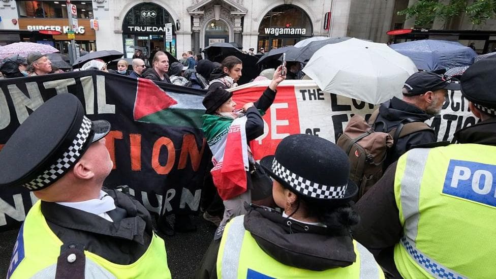Police escort pro-Palestinian protesters in London during a march attended by around 100 people on the third anniversary of the 7 October attack.