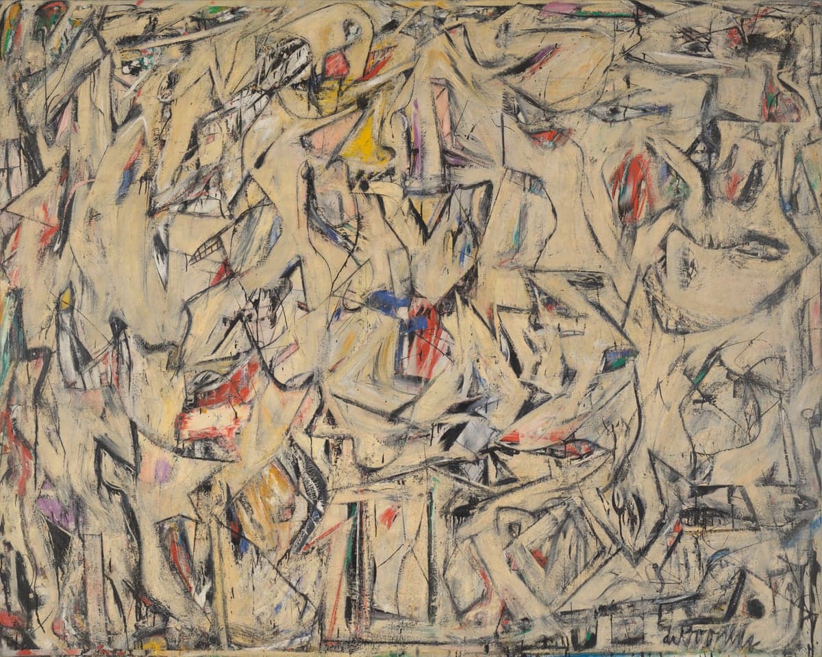 Willem de Kooning's Excavation abstract painting with chaotic black lines, beige tones, and bursts of red, yellow, and blue