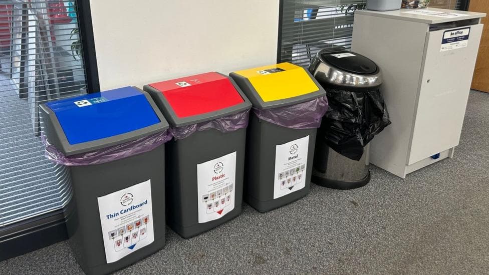 Recycling bins in an office.