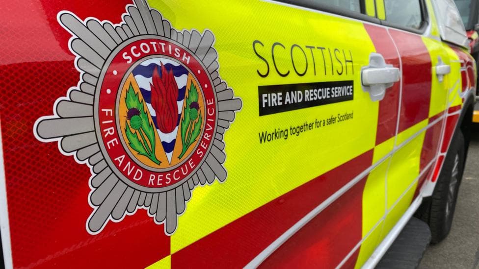 Close up of the logo on a Scottish Fire and Rescue Service vehicle