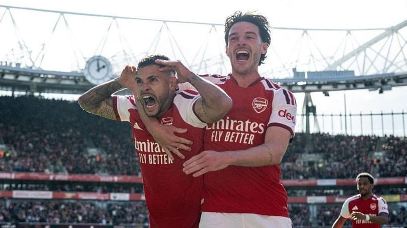 Bruno Guimaraes and Declan Rice celebrate.