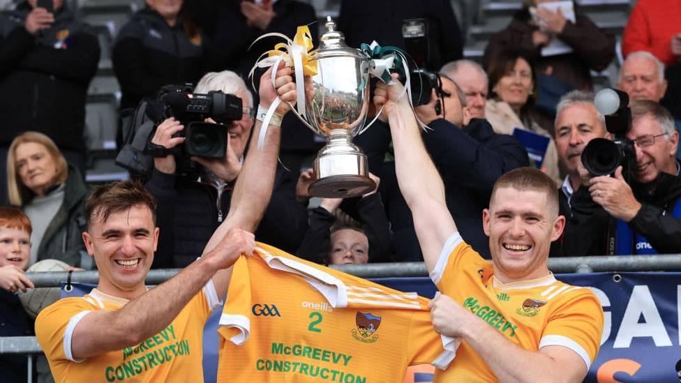 Stephen McConville and Charlie Carr lift the Frank O'Hare Cup
