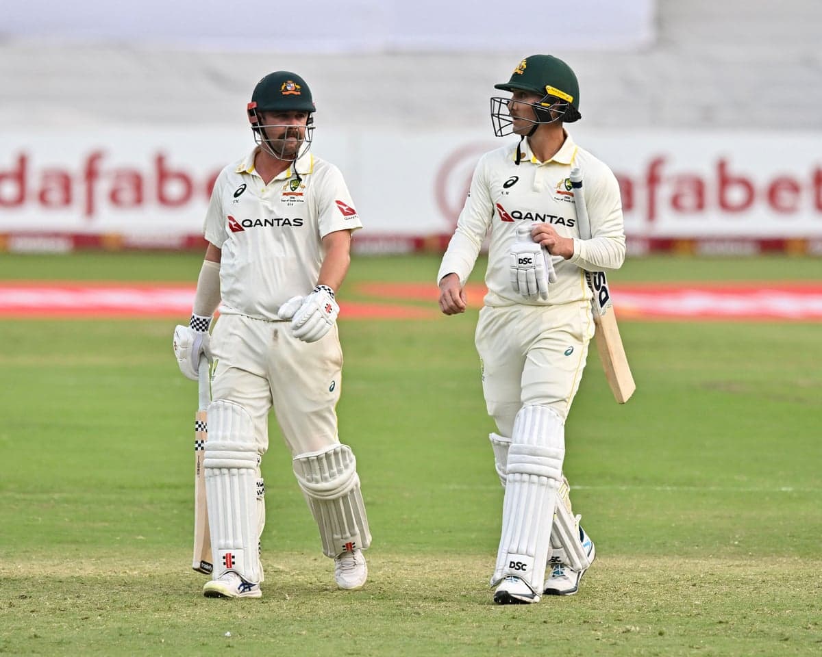 Australia’s Travis Head of Australia and Nic Maddinson walk off at the end of day three of the first Test against South Africa.